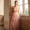 Abito lungo a bustier in tulle con volants