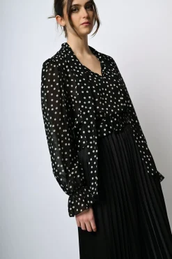 Blusa a stampa pois