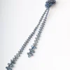 Collana lunga con perline e nodo