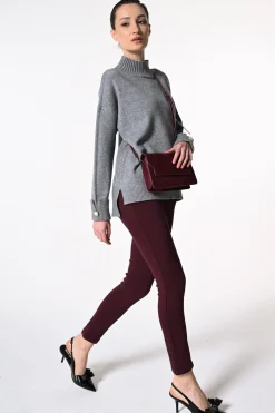 Jeans skinny con bottoni gioiello