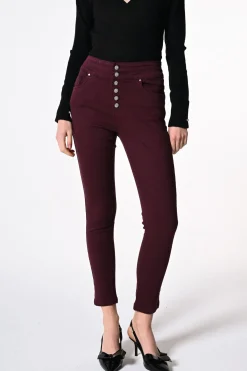 Jeans skinny con bottoni gioiello