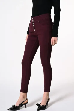 Jeans skinny con bottoni gioiello