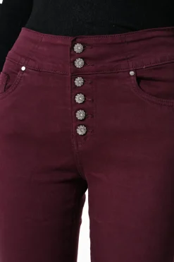 Jeans skinny con bottoni gioiello