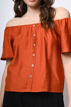 Top a spalle scoperte con bottoni