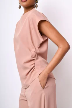 Top con arricciatura e bottoni sul retro