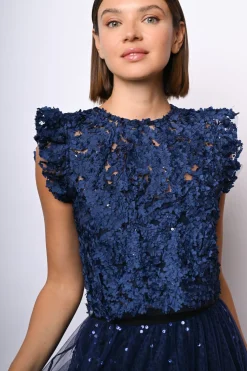 Top crop in pizzo floreale con paillettes