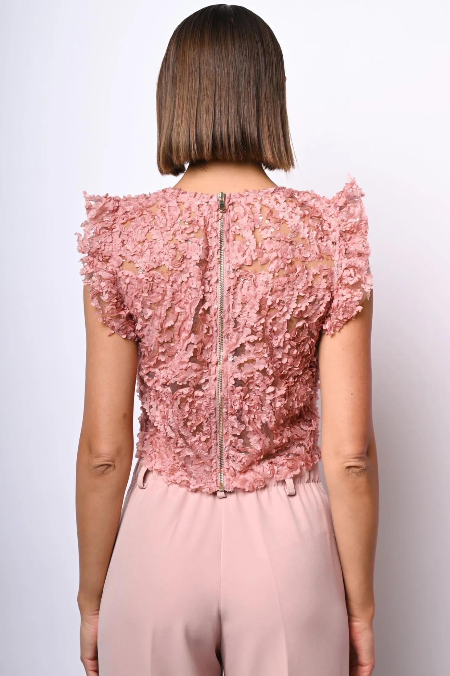 Top crop in pizzo floreale con paillettes