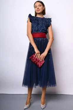 Top crop in pizzo floreale con paillettes